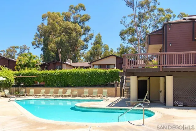 a view of a house with backyard porch and sitting area