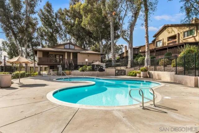 a view of a swimming pool with sitting area