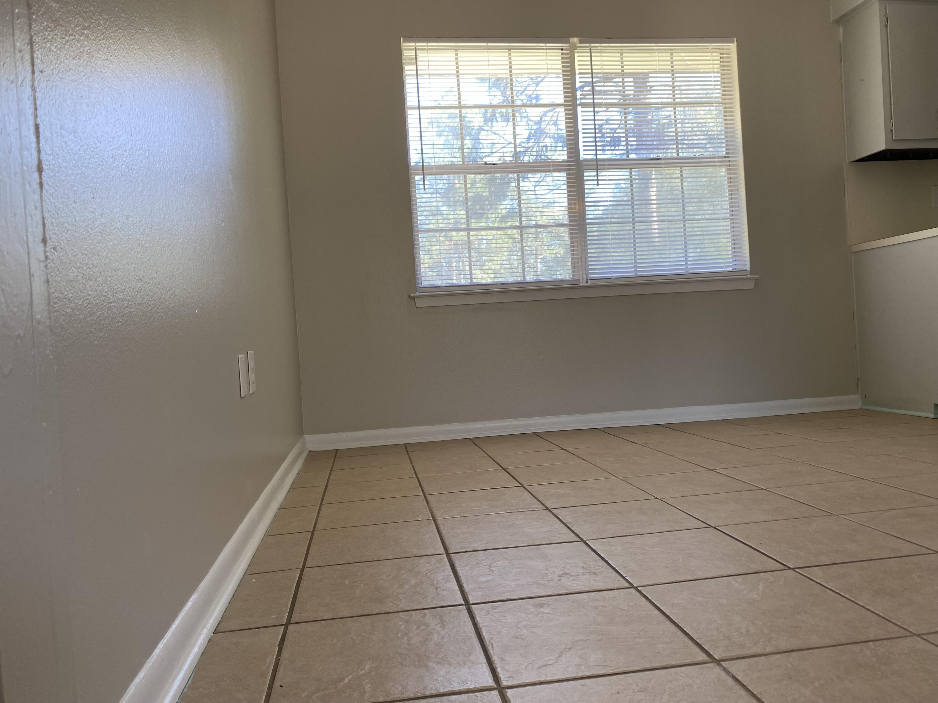 6173 Old Hickory Road Crestview, FL 32539 - Photo 5 of 22 a view of an empty room and window