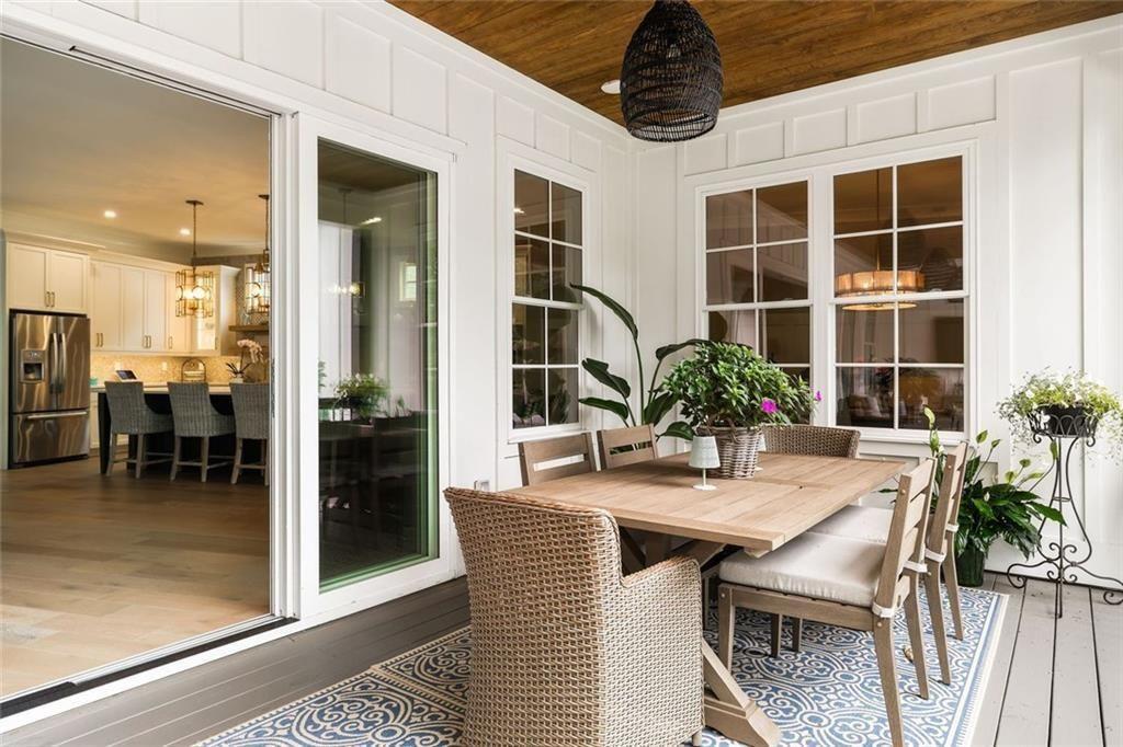 9370 Raldon Road Gainesville, GA 30506 - Photo 17 of 67 a dining room with furniture and a potted plant