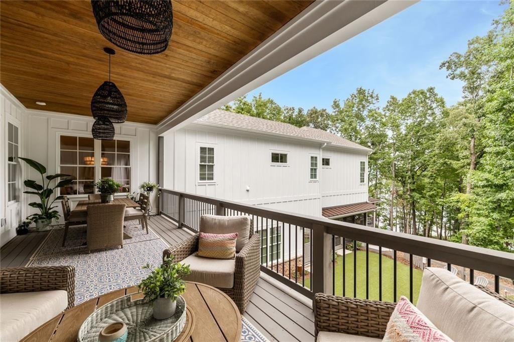 9370 Raldon Road Gainesville, GA 30506 - Photo 18 of 67 a view of balcony with furniture and wooden floor