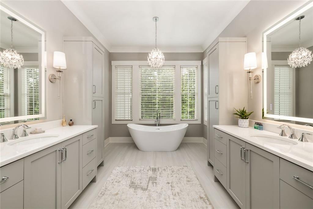 9370 Raldon Road Gainesville, GA 30506 - Photo 22 of 67 a spacious bathroom with a double vanity sink mirror and bathtub