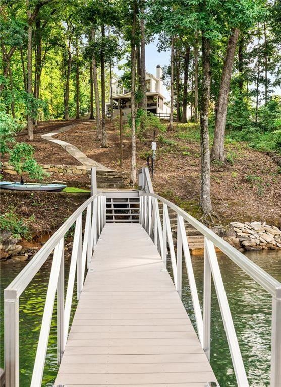 9370 Raldon Road Gainesville, GA 30506 - Photo 3 of 67 a view of a wooden deck and trees with wooden stairs