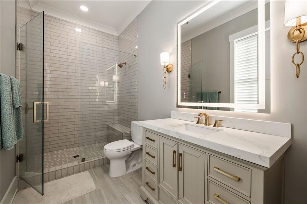 9370 Raldon Road Gainesville, GA 30506 - Photo 51 of 67 a bathroom with a sink toilet and shower