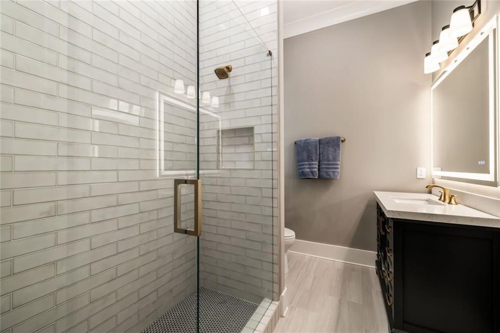 9370 Raldon Road Gainesville, GA 30506 - Photo 53 of 67 a bathroom with a sink a toilet and shower
