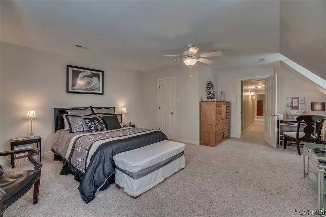 2803 Fairgate Road Midlothian, VA 23112 - Photo 25 of 50 a spacious bedroom with a bed and a chandelier