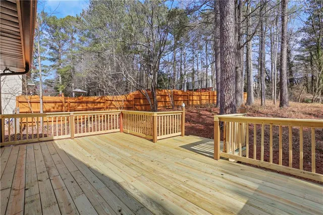 a view of a house with wooden deck