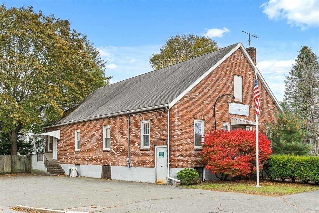 18 Raymond Place Winchester, MA 01890 - Photo 3 of 16 a front view of a house with garden