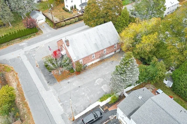 an aerial view of residential building with parking