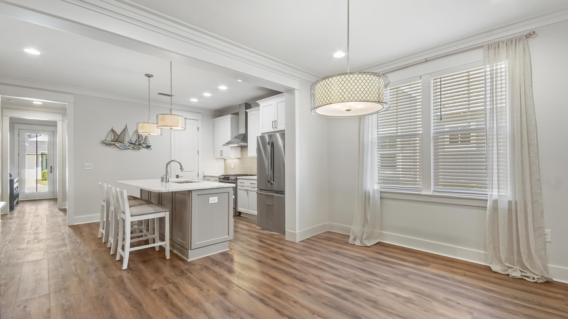 307 Sandchase Cir Inlet Beach Inlet Beach, FL 32461 - Photo 22 of 64 a kitchen with kitchen island stainless steel appliances a table and chairs