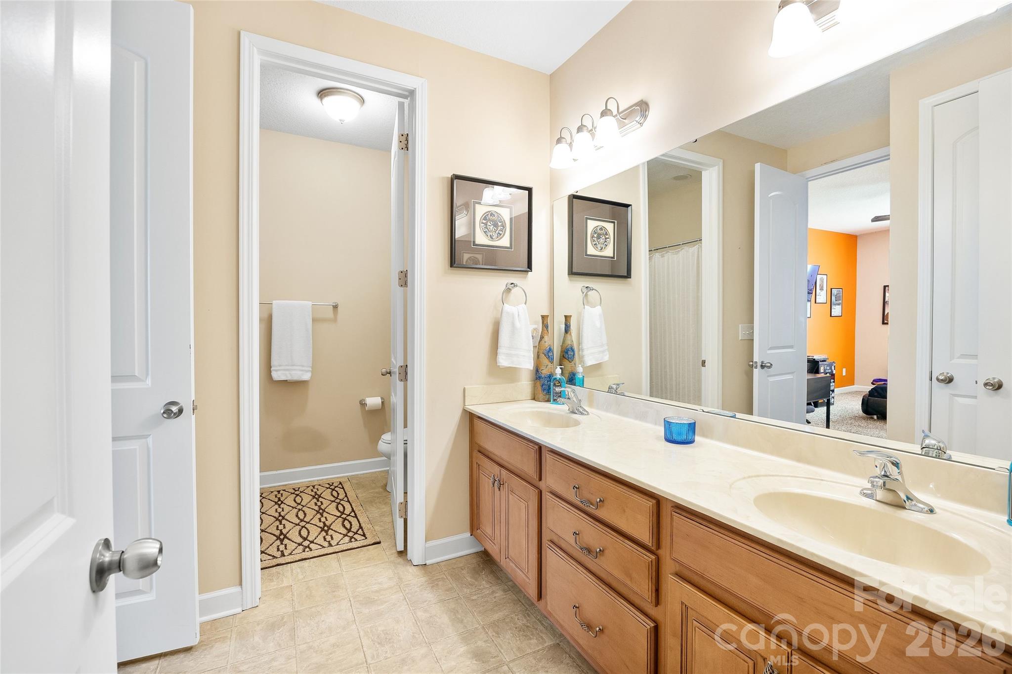 2240 Creek View Court Fort Mill, SC 29707 - Photo 25 of 40 a spacious bathroom with double vanity sinks a shower and a mirror