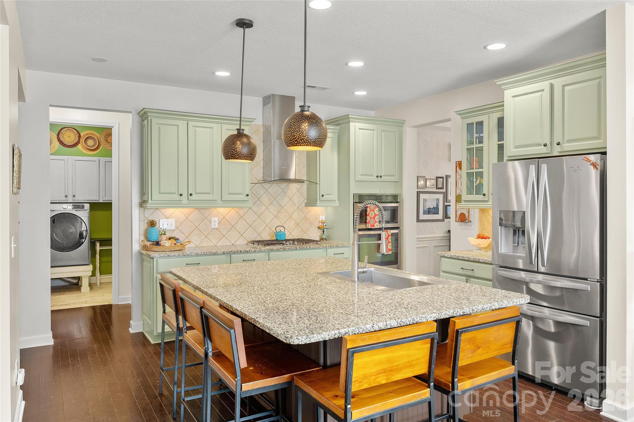 2240 Creek View Court Fort Mill, SC 29707 - Photo 8 of 40 a kitchen with stainless steel appliances granite countertop a stove refrigerator and wooden floor