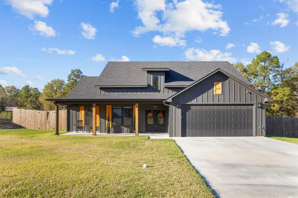 a front view of house with an outdoor space