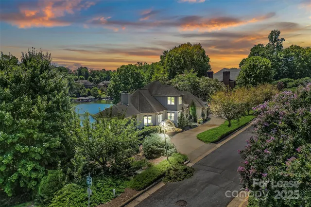 a view of a garden with a building in the background