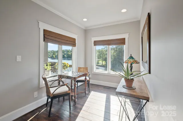 a view of a livingroom with furniture window and wooden floor
