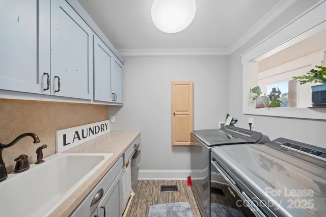a kitchen that has a sink and a stove