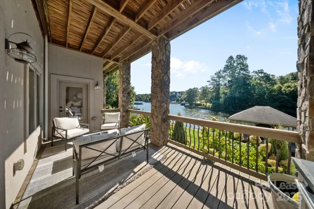 a view of a balcony with wooden floor