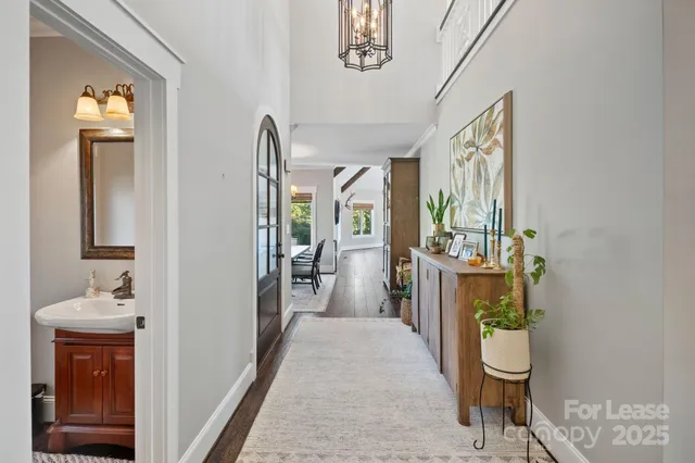 a view of a hallway and dining room
