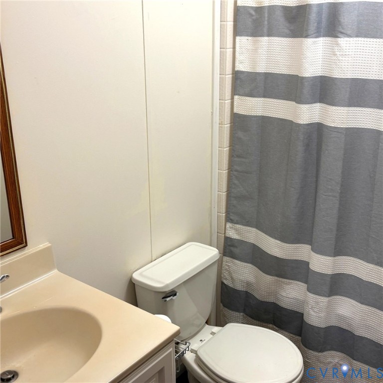 102 Frenchs Store Road Cumberland, VA 23040 - Photo 6 of 13 Hall bathroom featuring a neutral-toned vanity wit