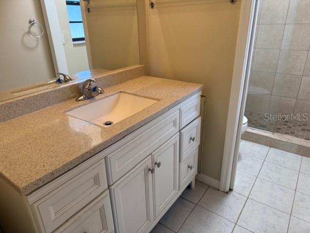 306 Cabot Street Inverness, FL 34452 - Photo 7 of 10 a bathroom with a sink and a mirror