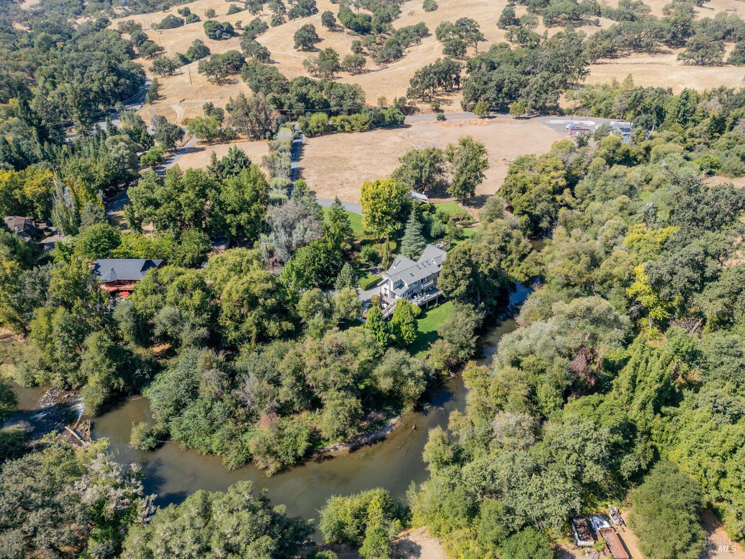 8301 West Potter Valley Road Potter Valley, CA 95469 - Photo 3 of 88 an aerial view of house with yard and outdoor seating