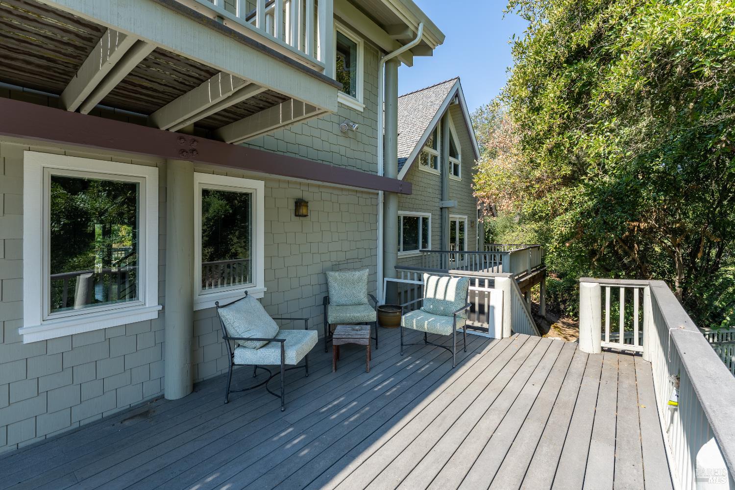 8301 West Potter Valley Road Potter Valley, CA 95469 - Photo 37 of 88 a view of deck with table and chairs and wooden floor