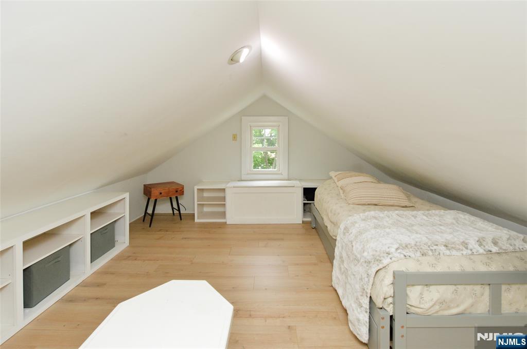 570 Shelton Road Ridgewood, NJ 07450 - Photo 20 of 26 a bedroom with a bed and a cabinets