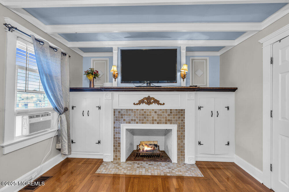 401 Joline Avenue Long Branch, NJ 07740 - Photo 11 of 30 a living room with a fireplace and a window