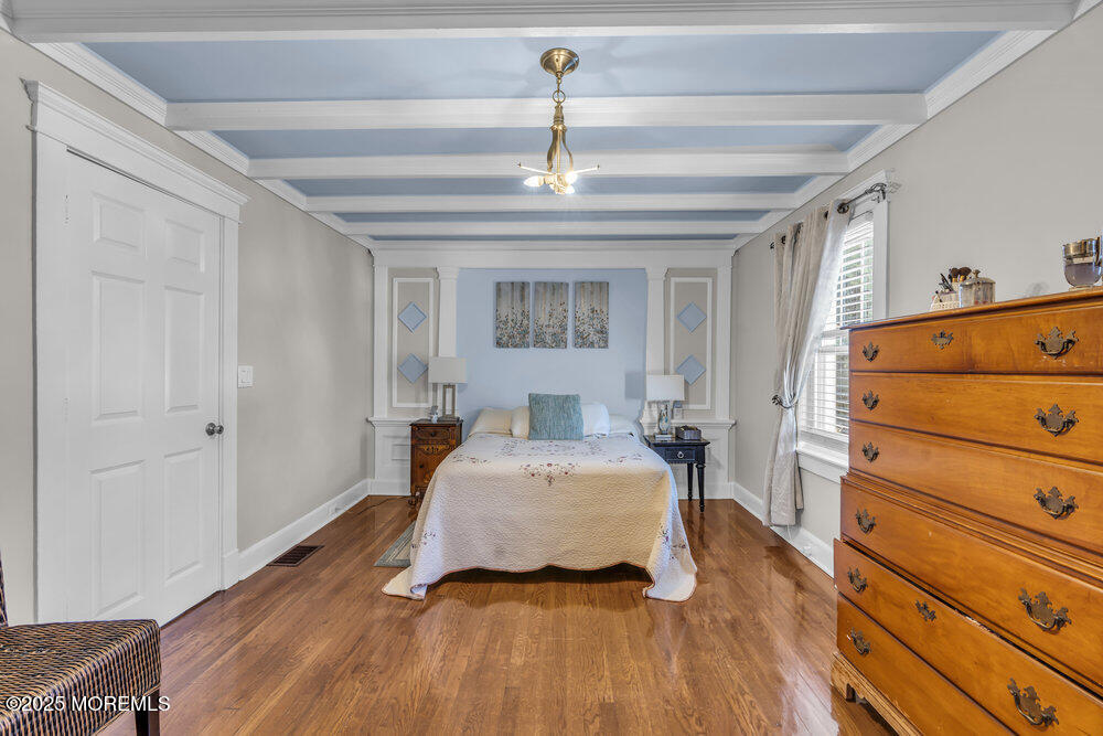 401 Joline Avenue Long Branch, NJ 07740 - Photo 12 of 30 a bedroom with a bed and wooden floor