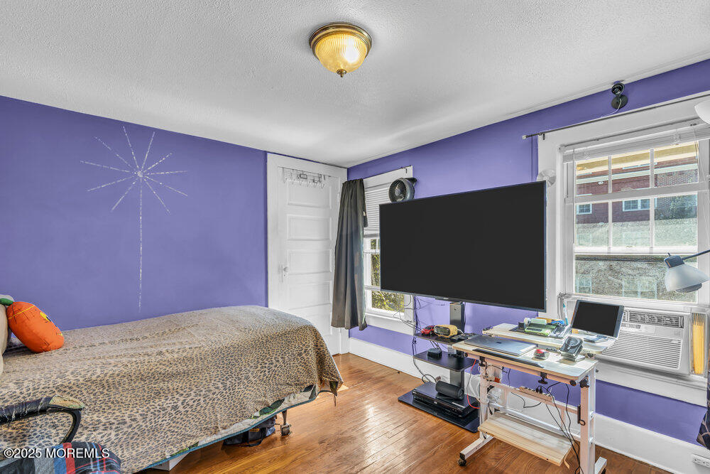 401 Joline Avenue Long Branch, NJ 07740 - Photo 14 of 30 a bedroom with a bed and a flat screen tv