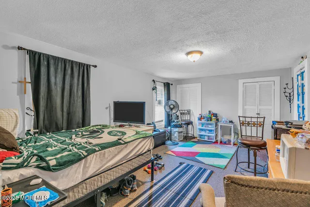 a bedroom with a bed and a table in it