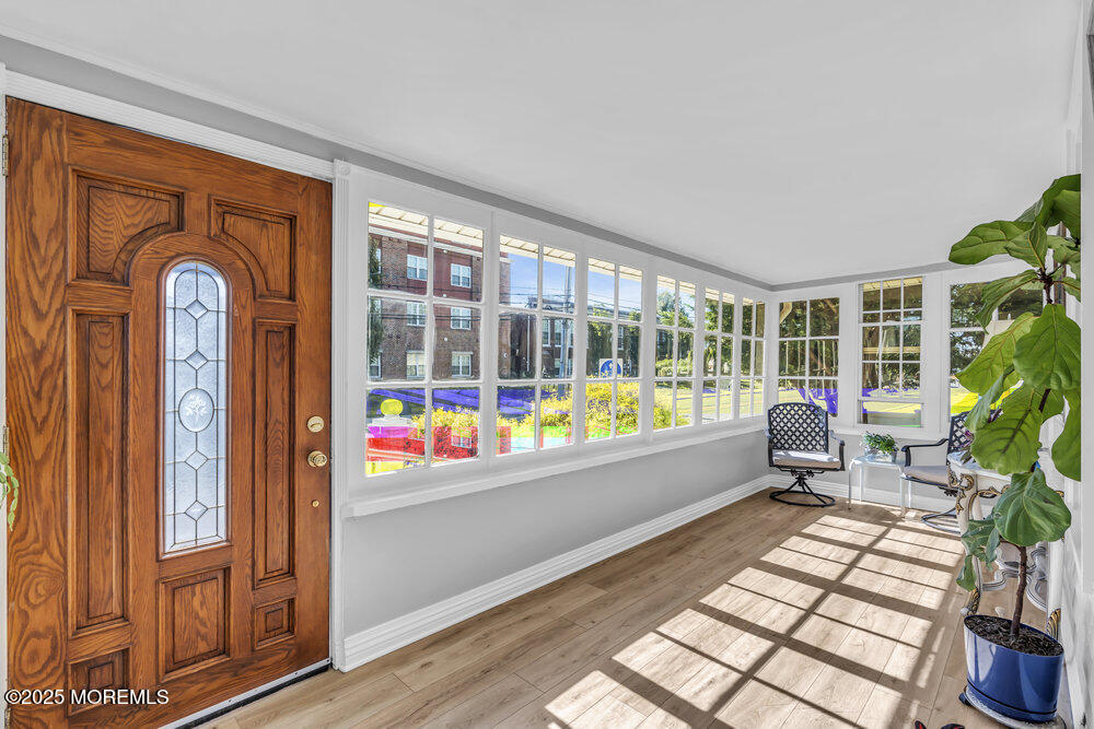 401 Joline Avenue Long Branch, NJ 07740 - Photo 2 of 30 a living room with furniture and a potted plant