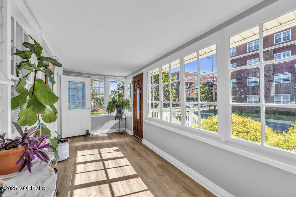 401 Joline Avenue Long Branch, NJ 07740 - Photo 3 of 30 a view of front door and porch with wooden floor
