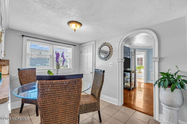 a view of a livingroom with furniture and a potted plant