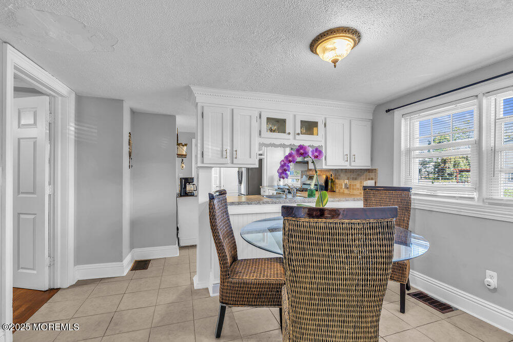 401 Joline Avenue Long Branch, NJ 07740 - Photo 7 of 30 a view of a dining room with furniture window and wooden floor