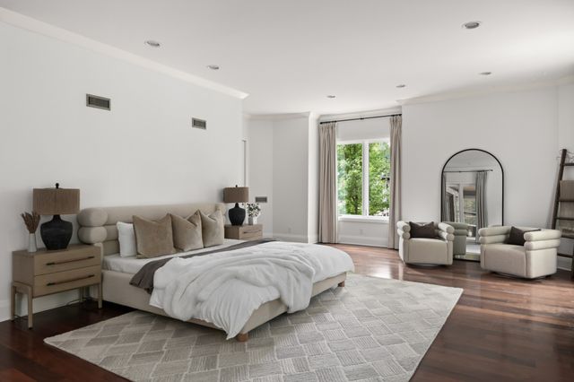 a bathroom with a sink a bathtub and a mirror