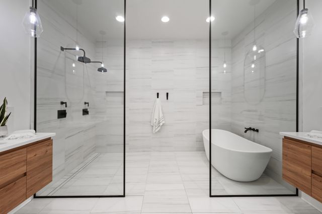 a bathroom with a shower and toilet