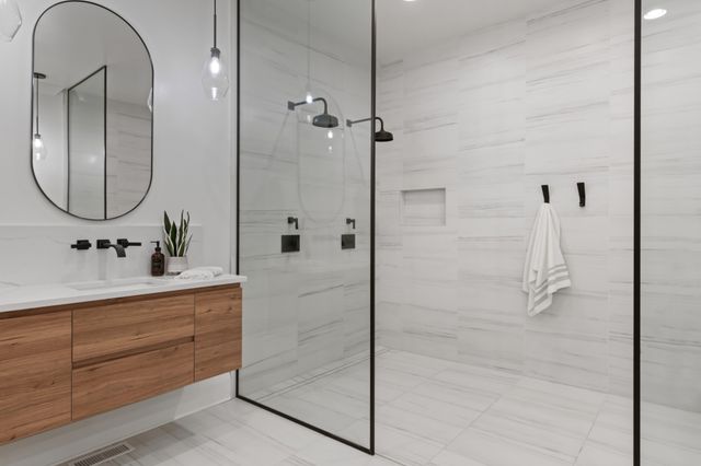 a spacious bathroom with a granite countertop sink and a mirror