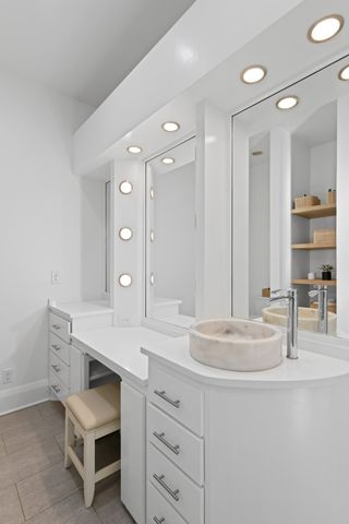 a living room with furniture a window and a fireplace