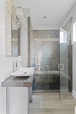 a living room with furniture and a floor to ceiling window