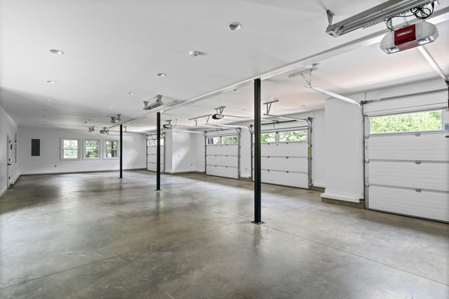 a bathroom with a sink a toilet a mirror and shower