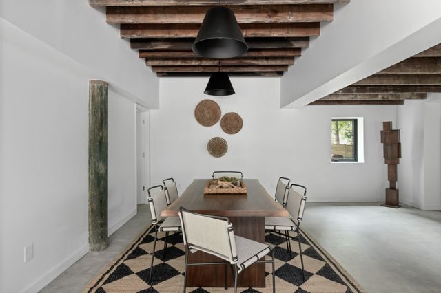 a view of living room with furniture and potted plant