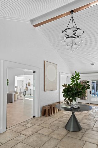 a view of a patio with a table chairs and a backyard