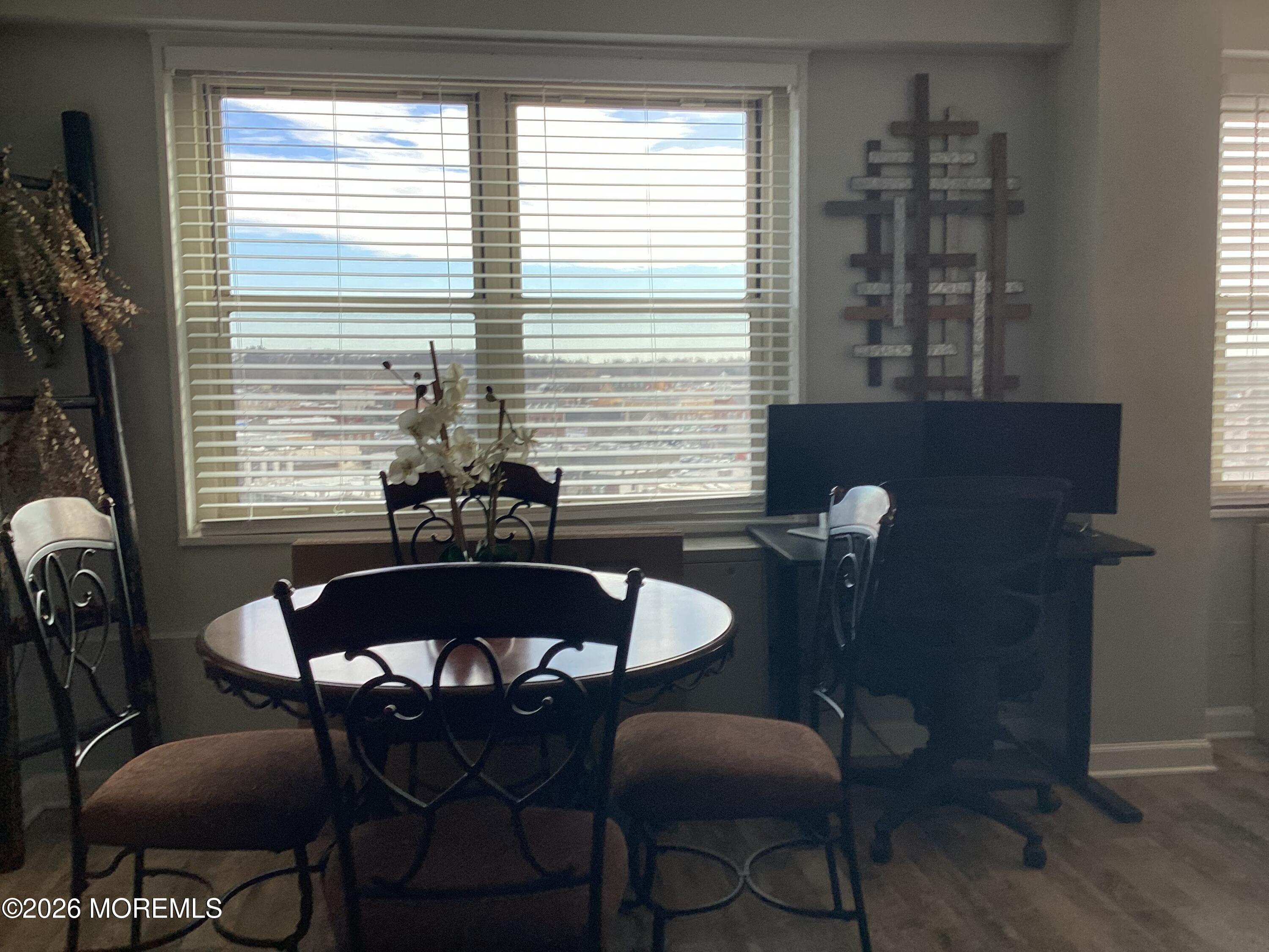 28 Riverside Avenue, Unit 9D Red Bank, NJ 07701 - Photo 1 of 15 a dining room with furniture and window