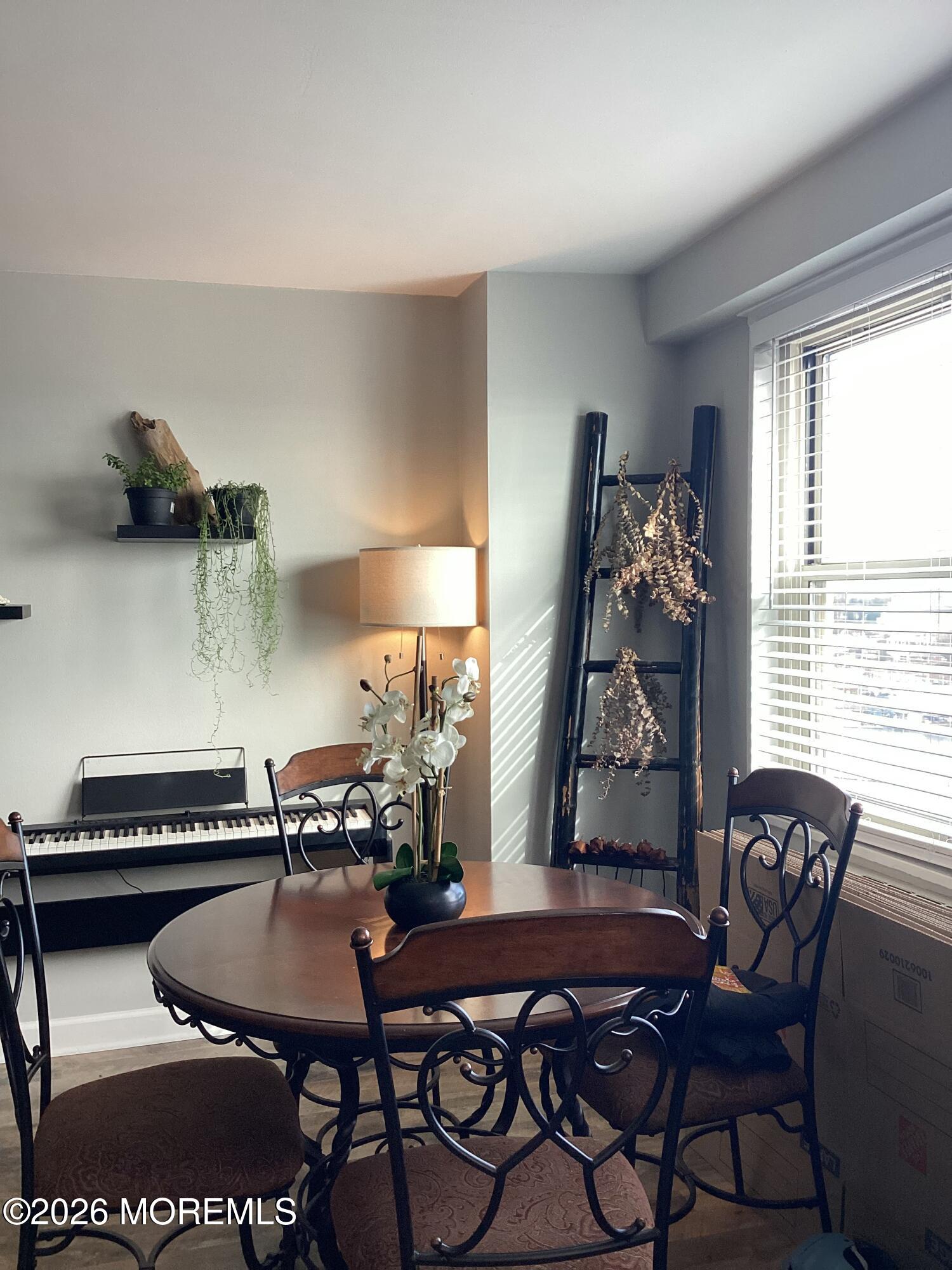 28 Riverside Avenue, Unit 9D Red Bank, NJ 07701 - Photo 4 of 15 a table and chairs in a room
