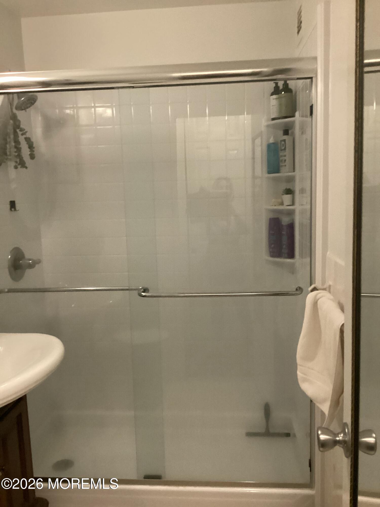 28 Riverside Avenue, Unit 9D Red Bank, NJ 07701 - Photo 9 of 15 a bathroom with a shower and a sink