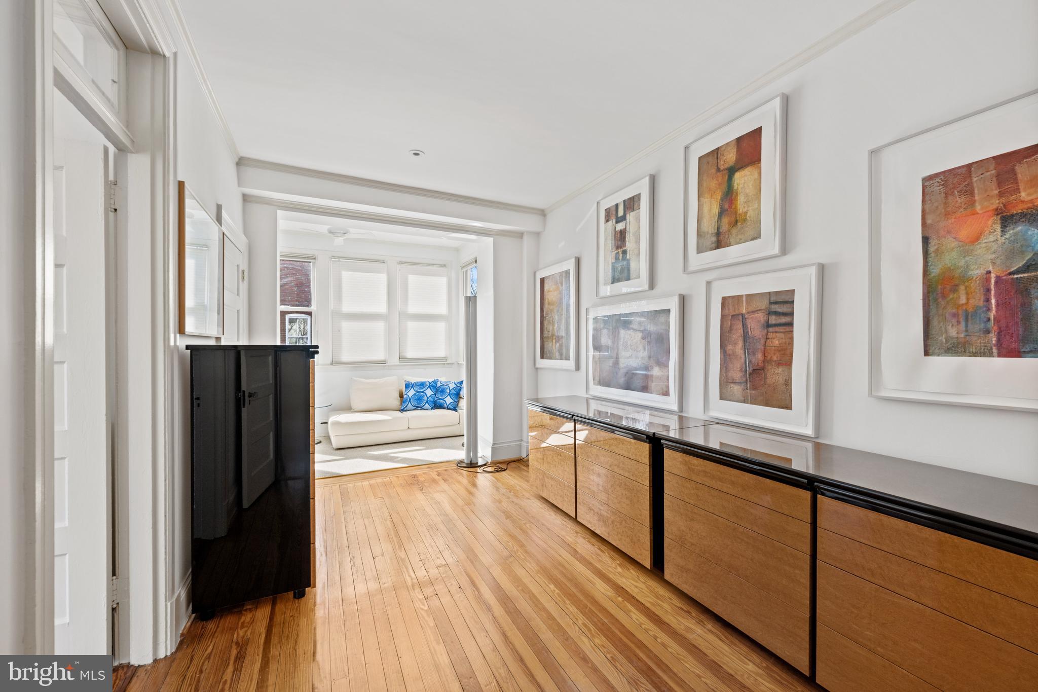 2862 28th Street Northwest Washington, DC 20008 - Photo 11 of 26 a view of a living room with wooden floor and a window