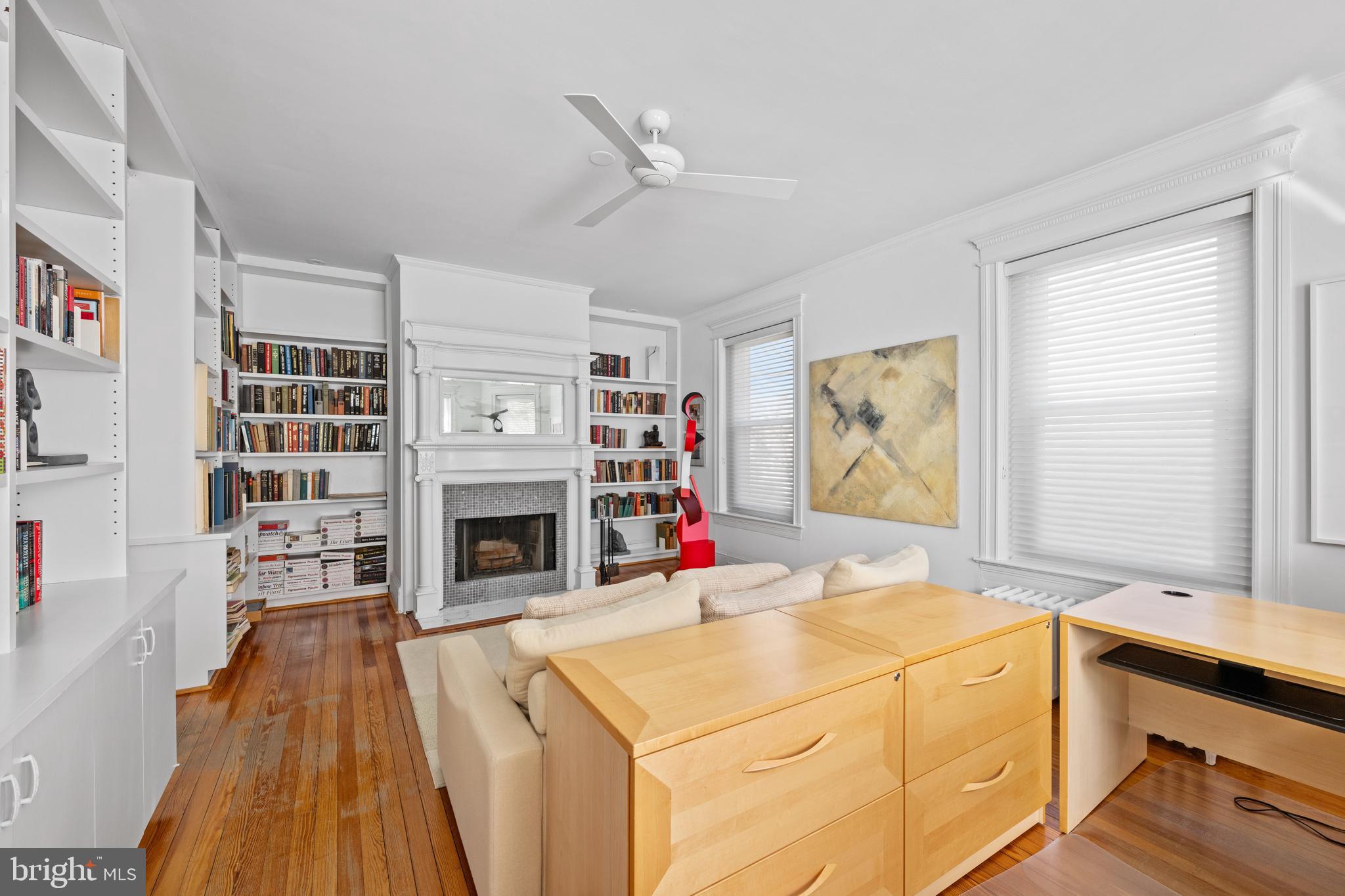 2862 28th Street Northwest Washington, DC 20008 - Photo 14 of 26 a living room with stainless steel appliances kitchen island a table and a fireplace