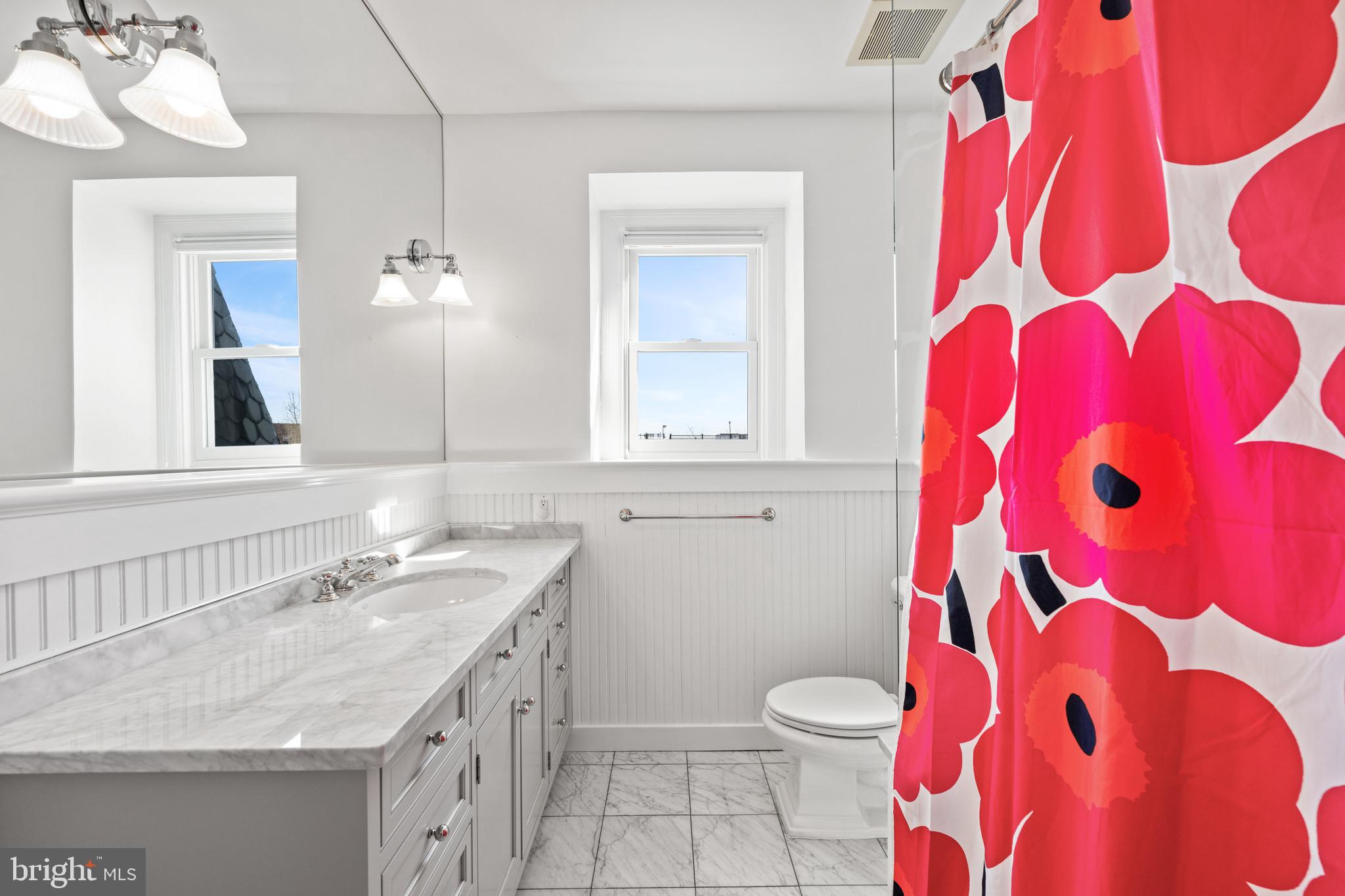 2862 28th Street Northwest Washington, DC 20008 - Photo 18 of 26 a bathroom with a sink toilet and mirror