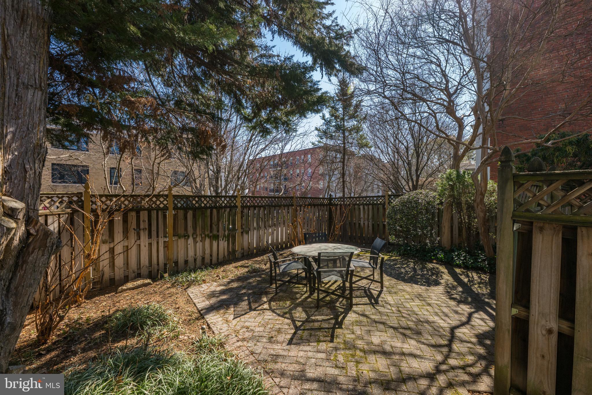 2862 28th Street Northwest Washington, DC 20008 - Photo 24 of 26 a patio with glass top table and chairs